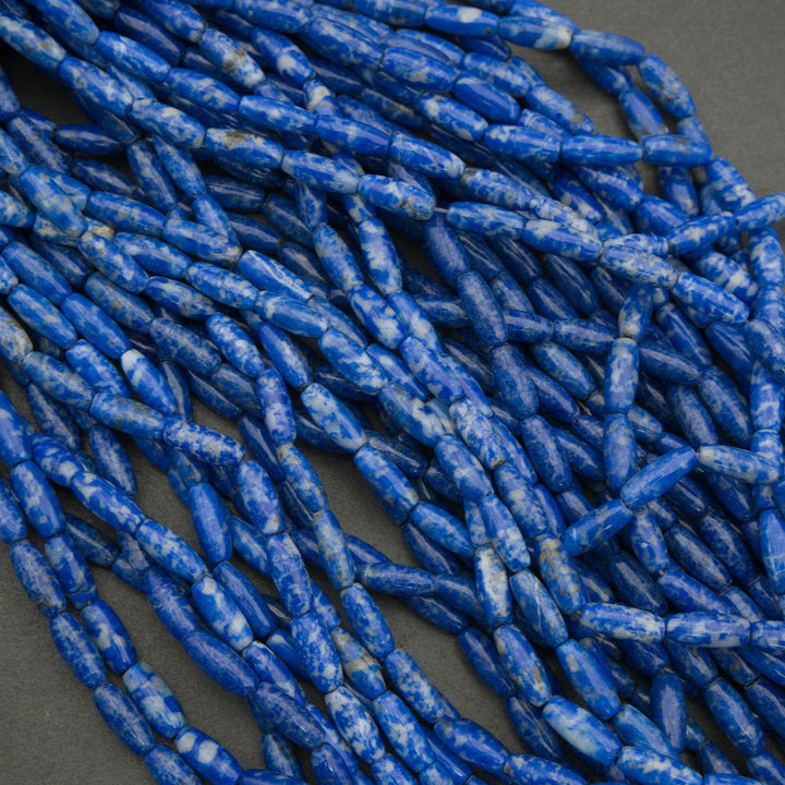 Close-up of blue cylindrical beads on a dark background