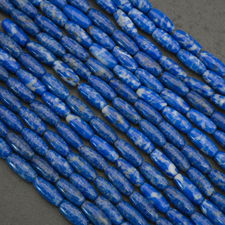 Close-up of blue cylindrical beads on a dark background