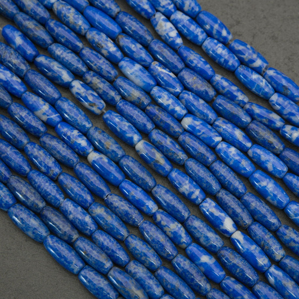 Close-up of blue cylindrical beads on a dark background