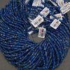 Natural blue lapis lazuli disk beads featuring rich cobalt blue coloring and distinctive white calcite markings.