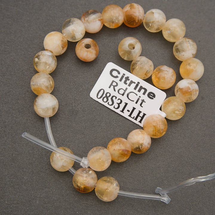 Natural citrine gemstone round beads on a strand