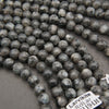 Grey marbled larvikite stone beads.