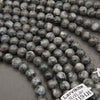 Grey marbled larvikite stone beads.