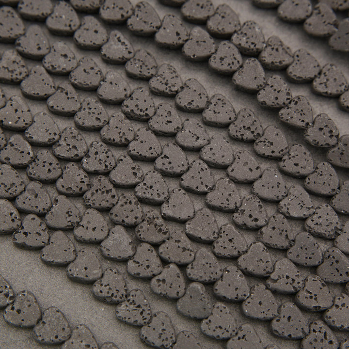Matte black lava rock heart-shaped gemstone beads for handmade bracelets, necklaces, and DIY jewelry.