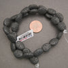 Black lava rock oval beads with a porous, lightweight texture, perfect for DIY jewelry making and beading projects
