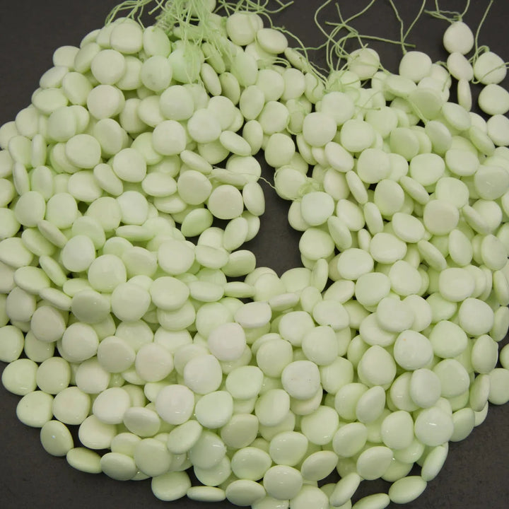 Light green beads on a dark background