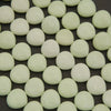 Close-up of light green beads on a dark background