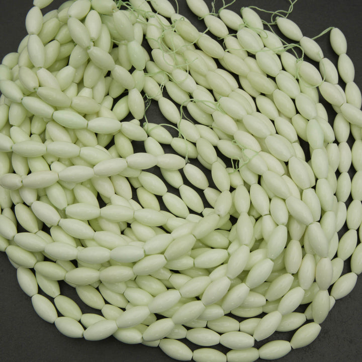 Neon green beads on a black background