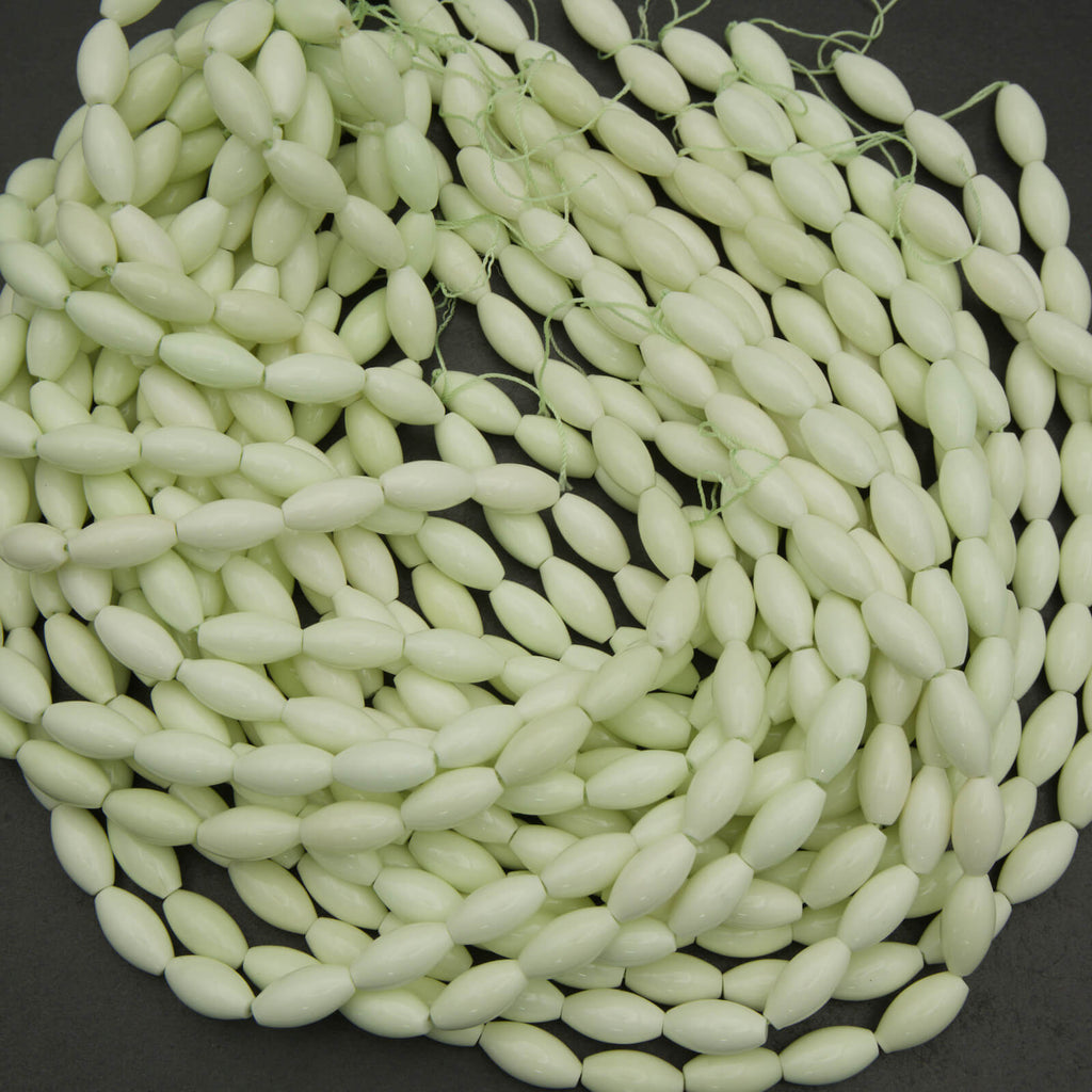 Neon green beads on a black background