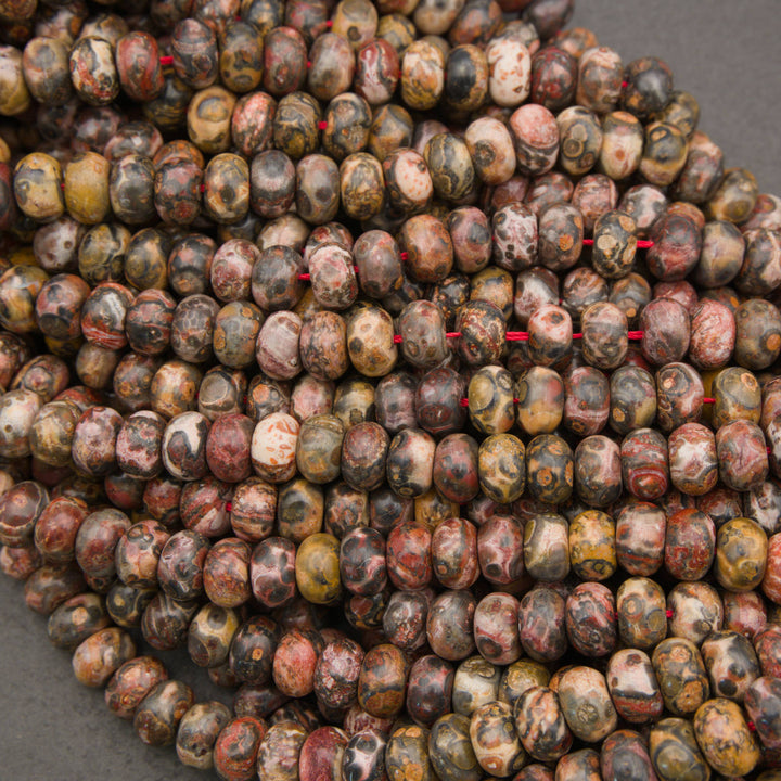 Polished Leopard Skin Jasper rondelle beads with distinctive spotted patterns
