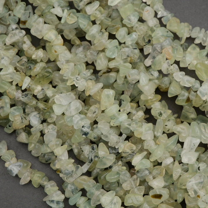 Close-up of small green stones on a dark background