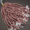 pink beads with tags