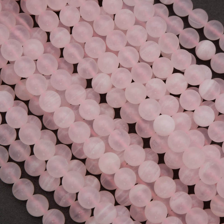 Close-up of pink beads on a dark background
