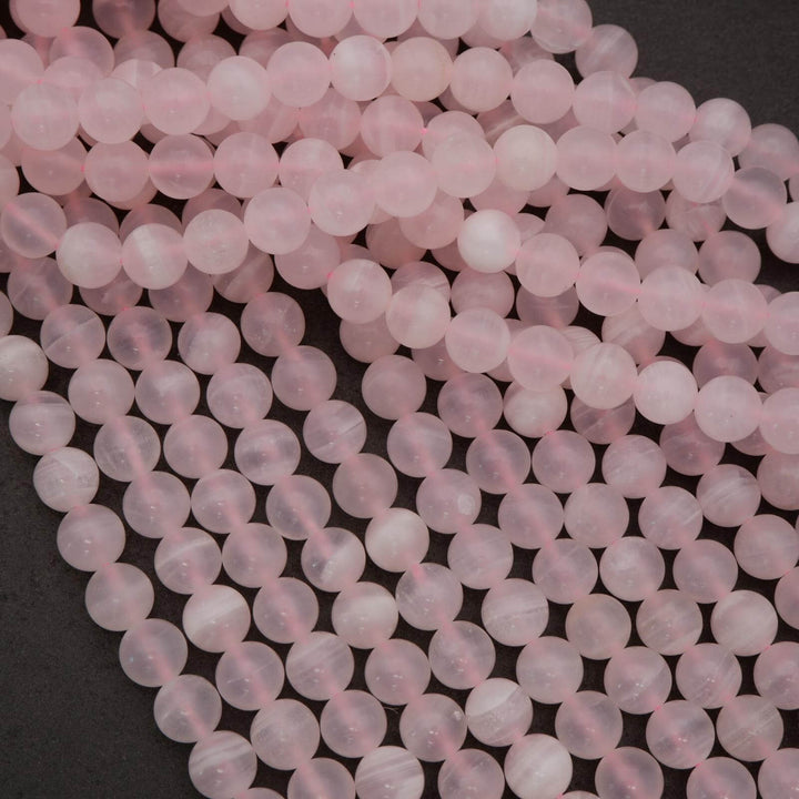 Close-up of pink beads on a dark background