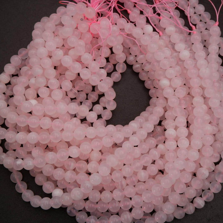 String of pink beads on a dark background