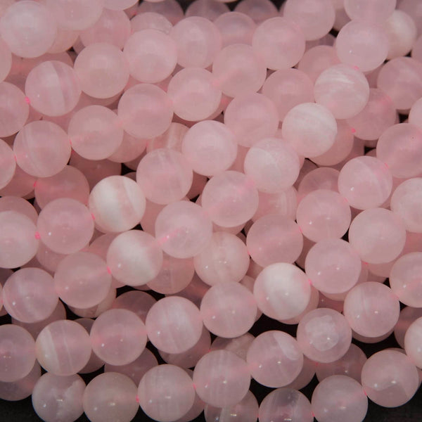 Close-up of pink beads on a black background
