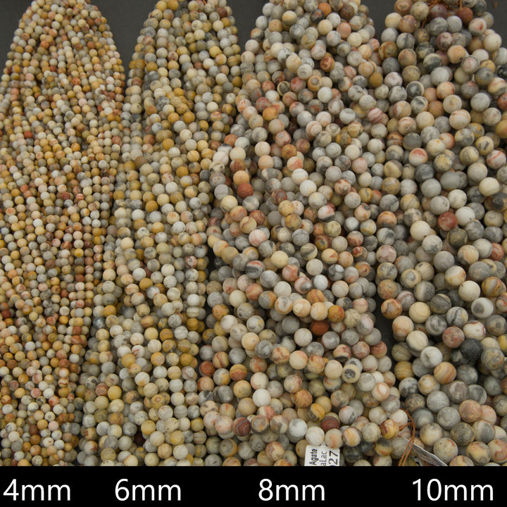 Close-up of multicolored beads with size labels at the bottom.