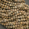 Close-up of a pile of beige and brown spherical objects