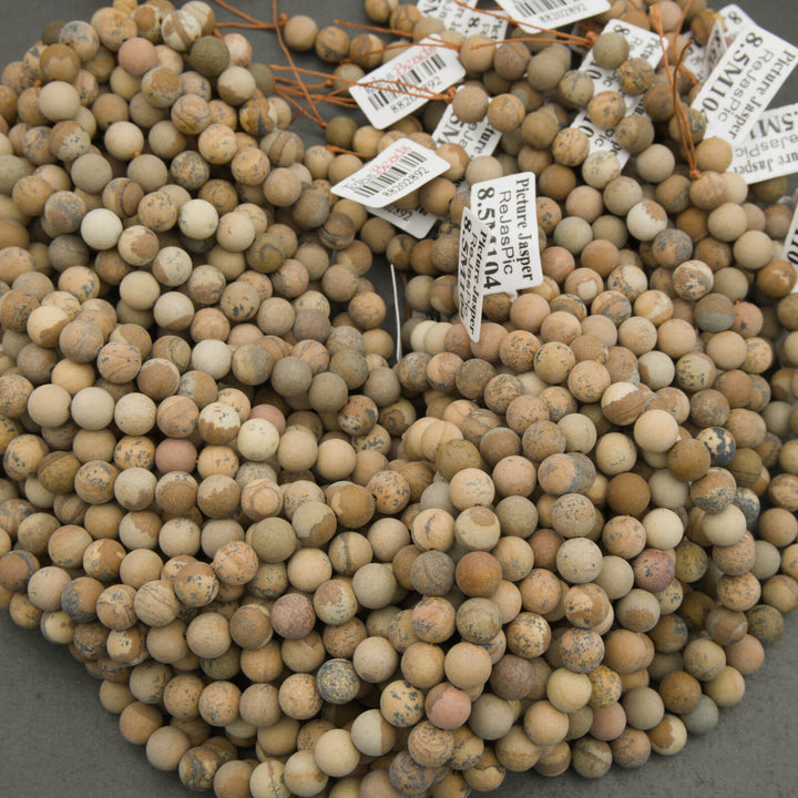 Close-up of a bundle of spherical stones with price tags attached.
