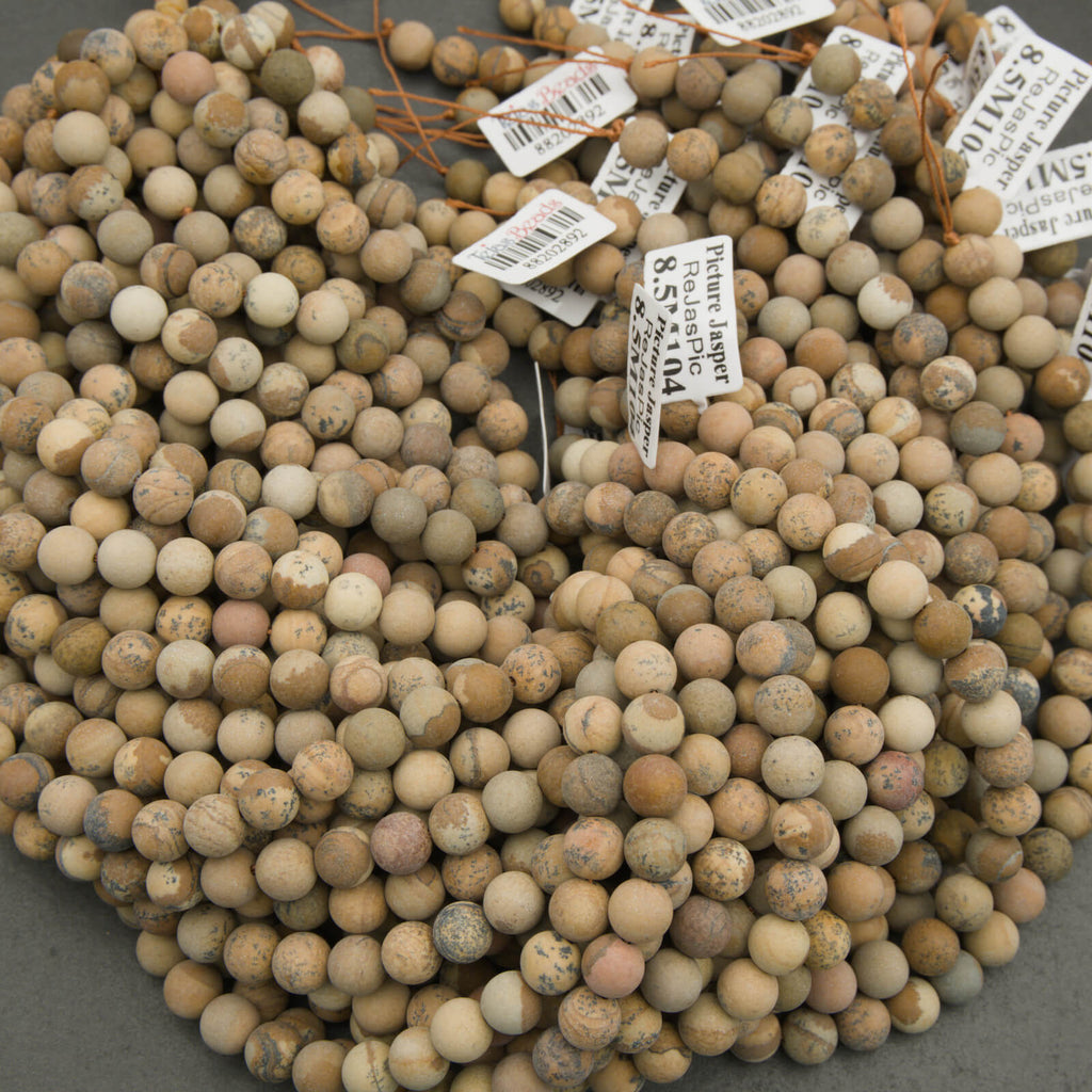 Close-up of a bundle of spherical stones with price tags attached.