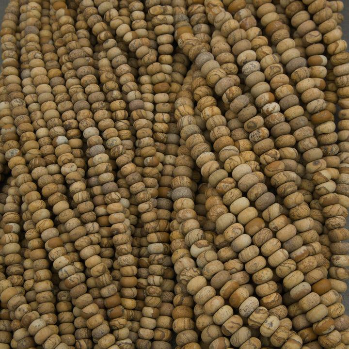 Close-up of a string of brown beads on a gray surface
