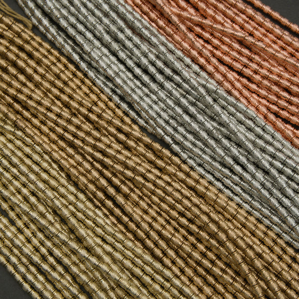 Close-up of textured fabric with brown, beige, and gray colors.