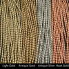 Three strands of beads in light gold, antique gold, and rose gold on a black background.