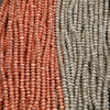 Close-up of red and silver beaded strands