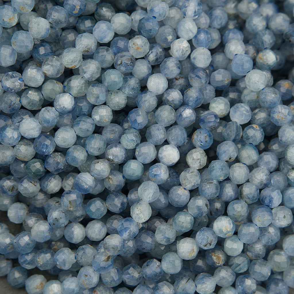 Faceted blue kyanite round beads with soft cloudy inclusions