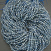 Pale blue kyanite round beads with natural internal veining