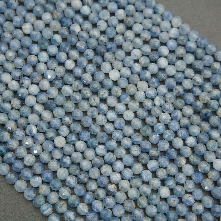 Multiple strands of faceted blue kyanite gemstone beads