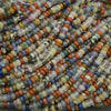 Close-up of multicolored beads arranged in a pile
