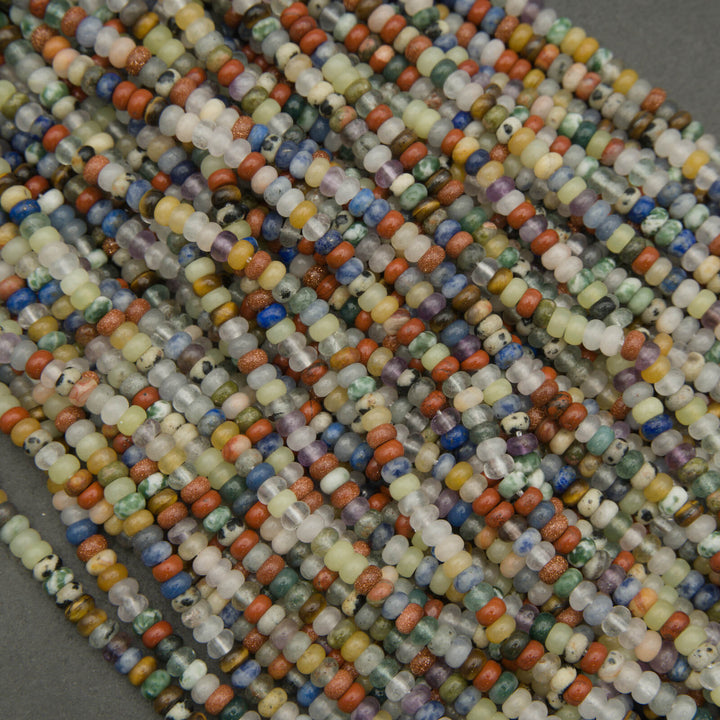 Close-up of multicolored beads arranged in a pattern on a gray background