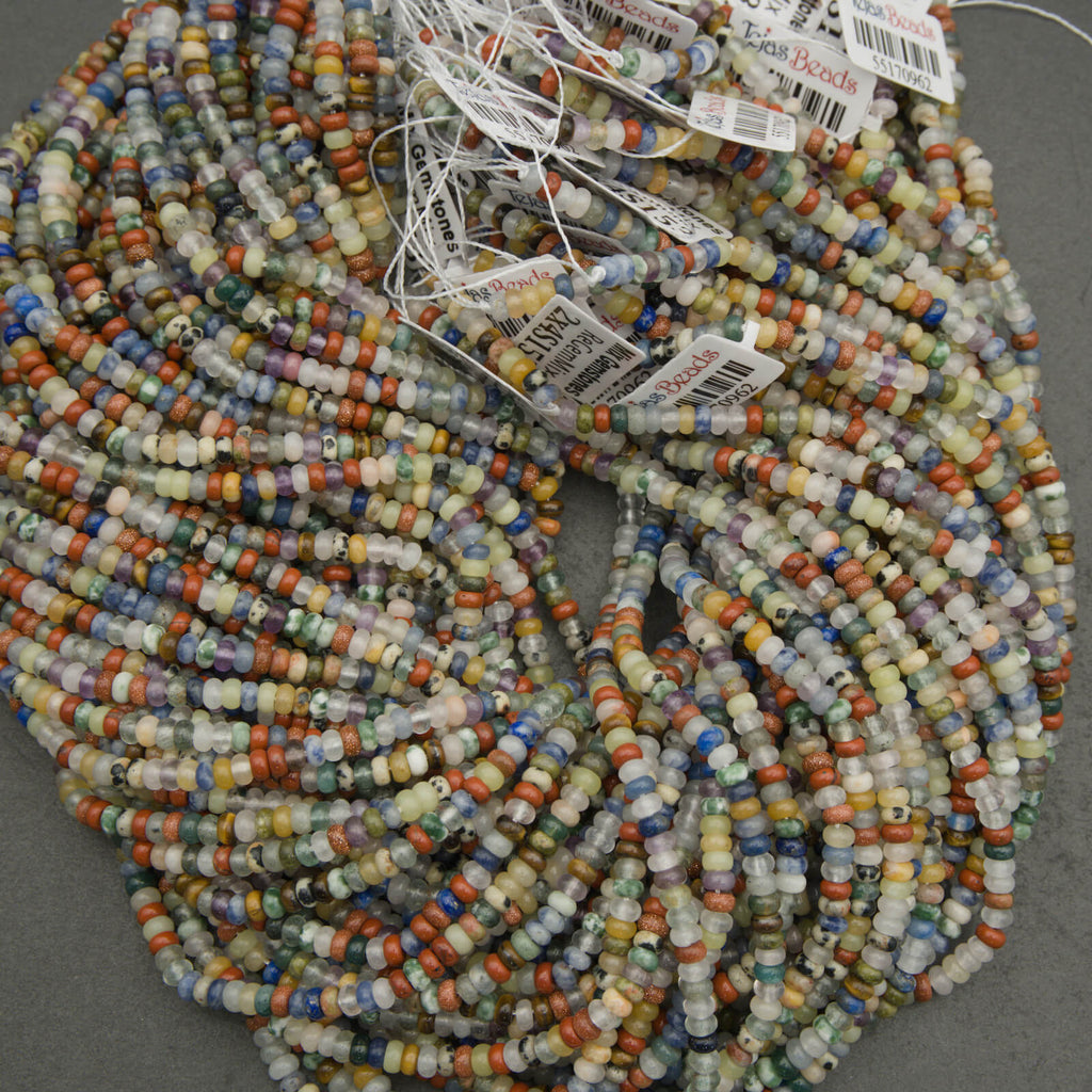 Multicolored beads on a string with 'Beads' tags attached, on a gray background