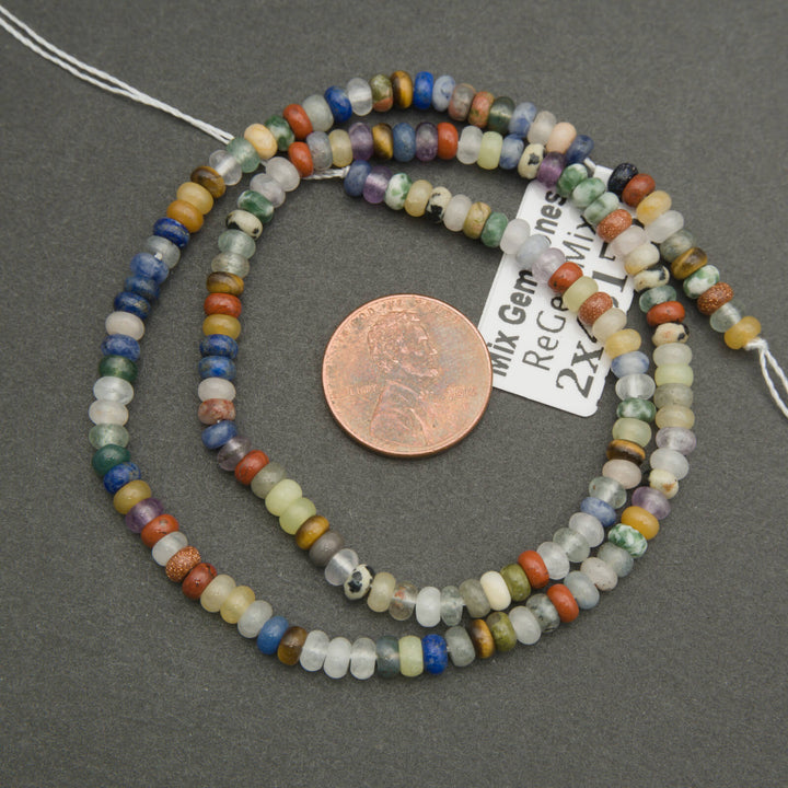 Multicolored bead necklace with a penny for scale on a gray background