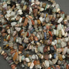 Close-up of multicolored pebbles on a gray background