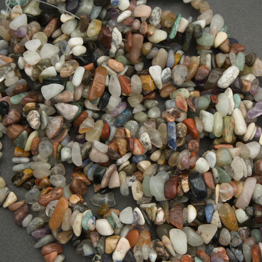 Close-up of multicolored pebbles on a gray background
