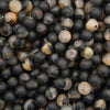 Natural calico tourmaline beads featuring distinctive multicolor patterns and a soft matte surface for jewelry making.