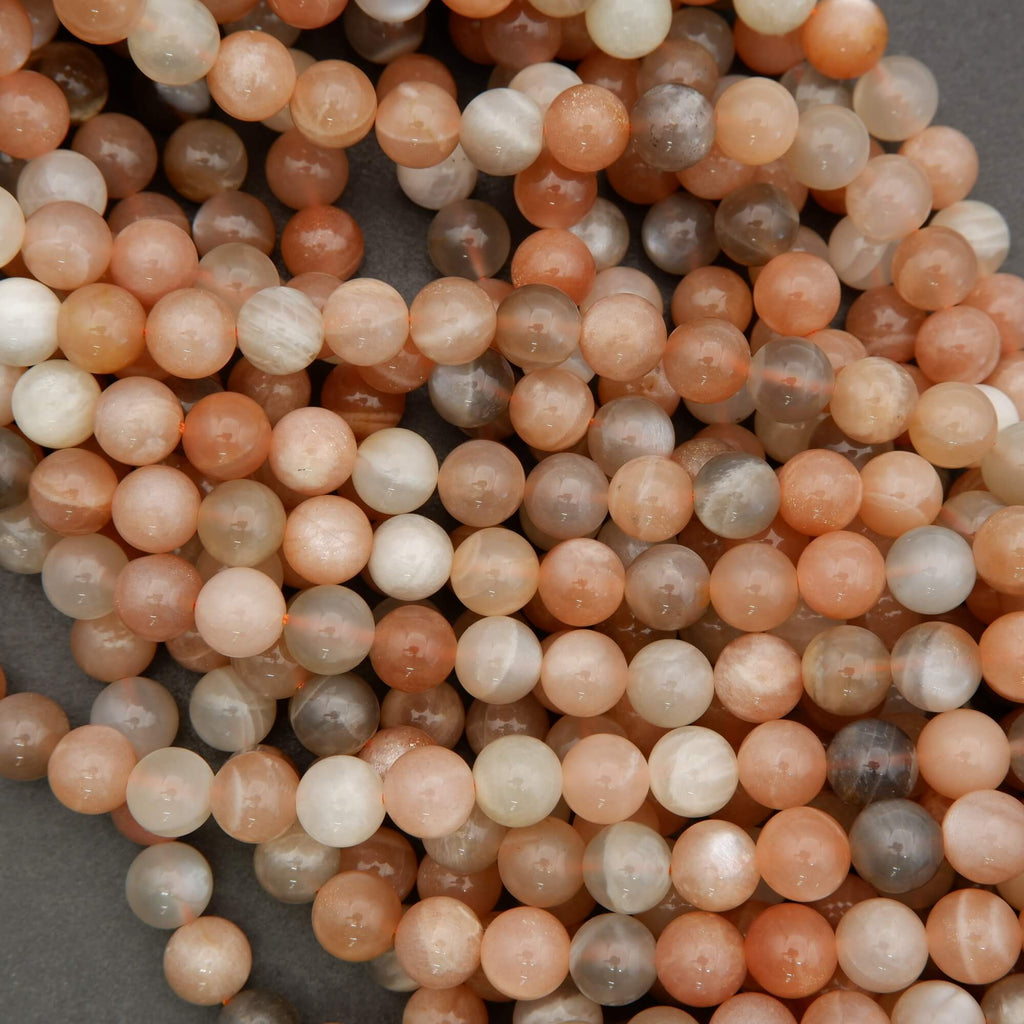 Close-up of multicolored round beads on a gray background