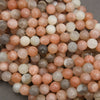 Close-up of multicolored round beads on a gray background