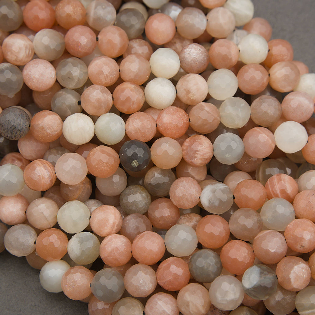 Close-up of multicolored round beads on a gray background