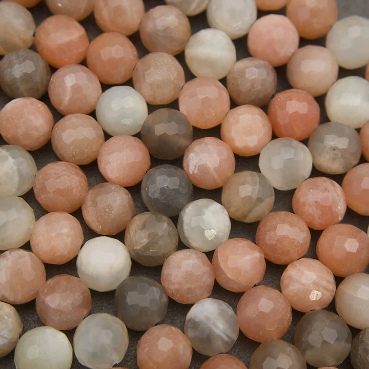 Close-up of multicolored round beads on a textured surface
