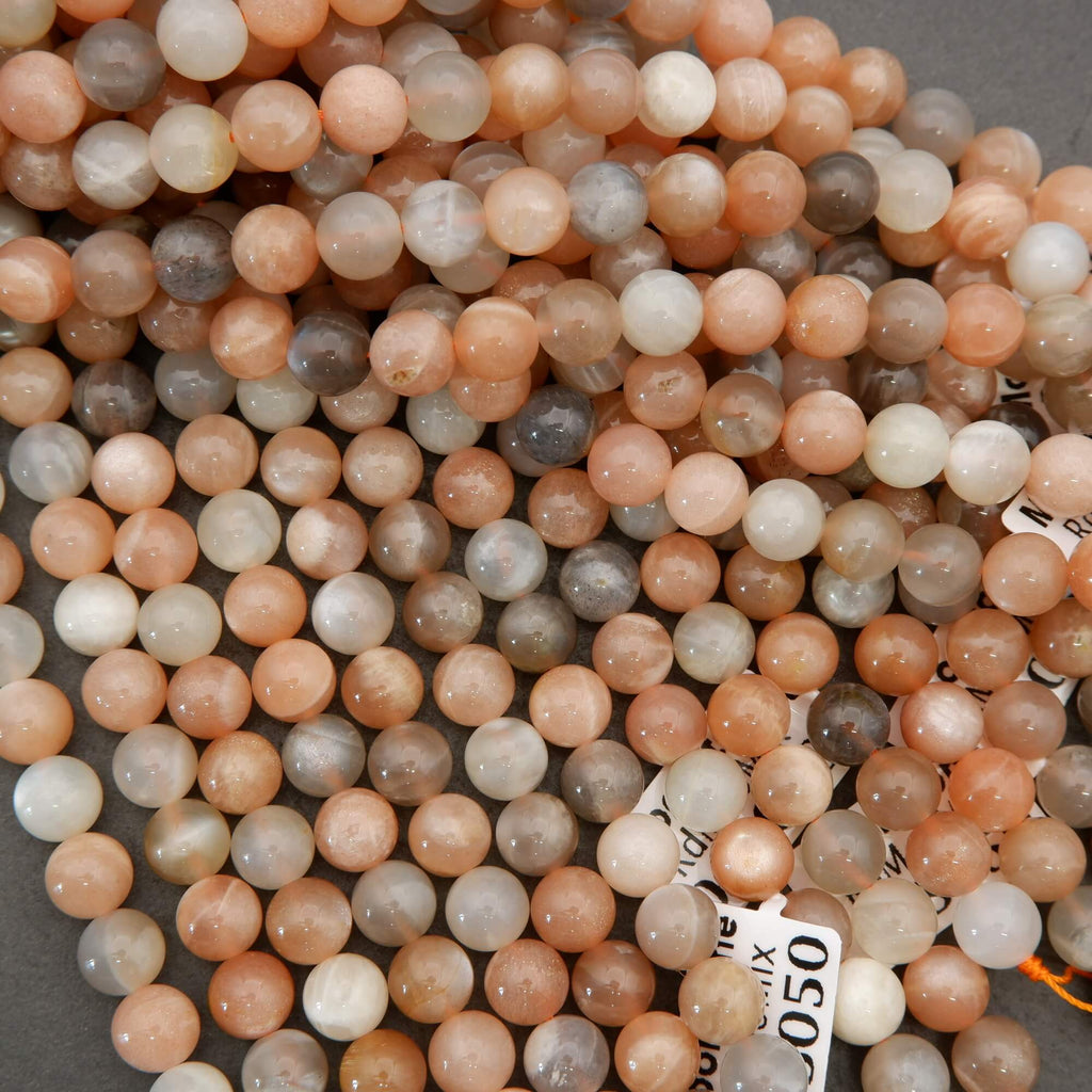 Close-up of multicolored round beads on a gray surface