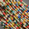 Close-up of multicolored beads on a gray background