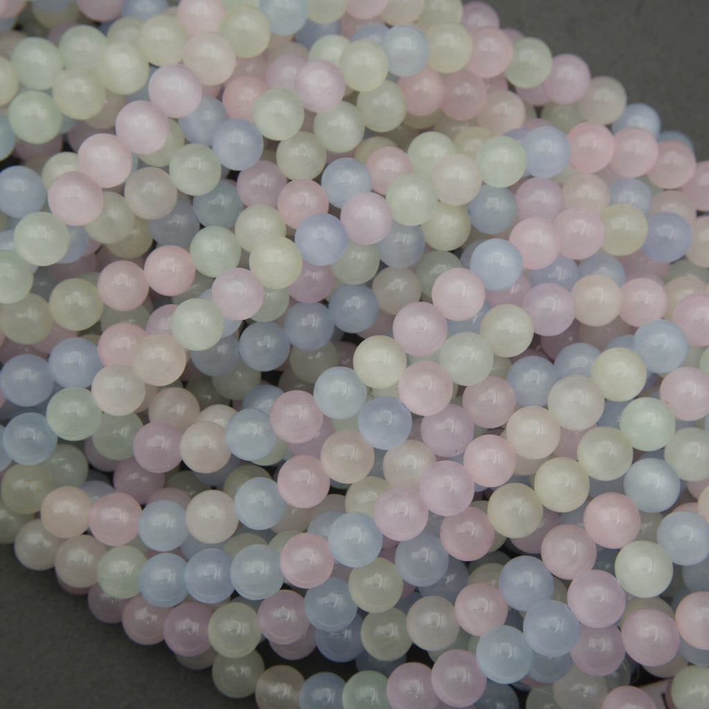 Close-up of pastel-colored beads on a dark background
