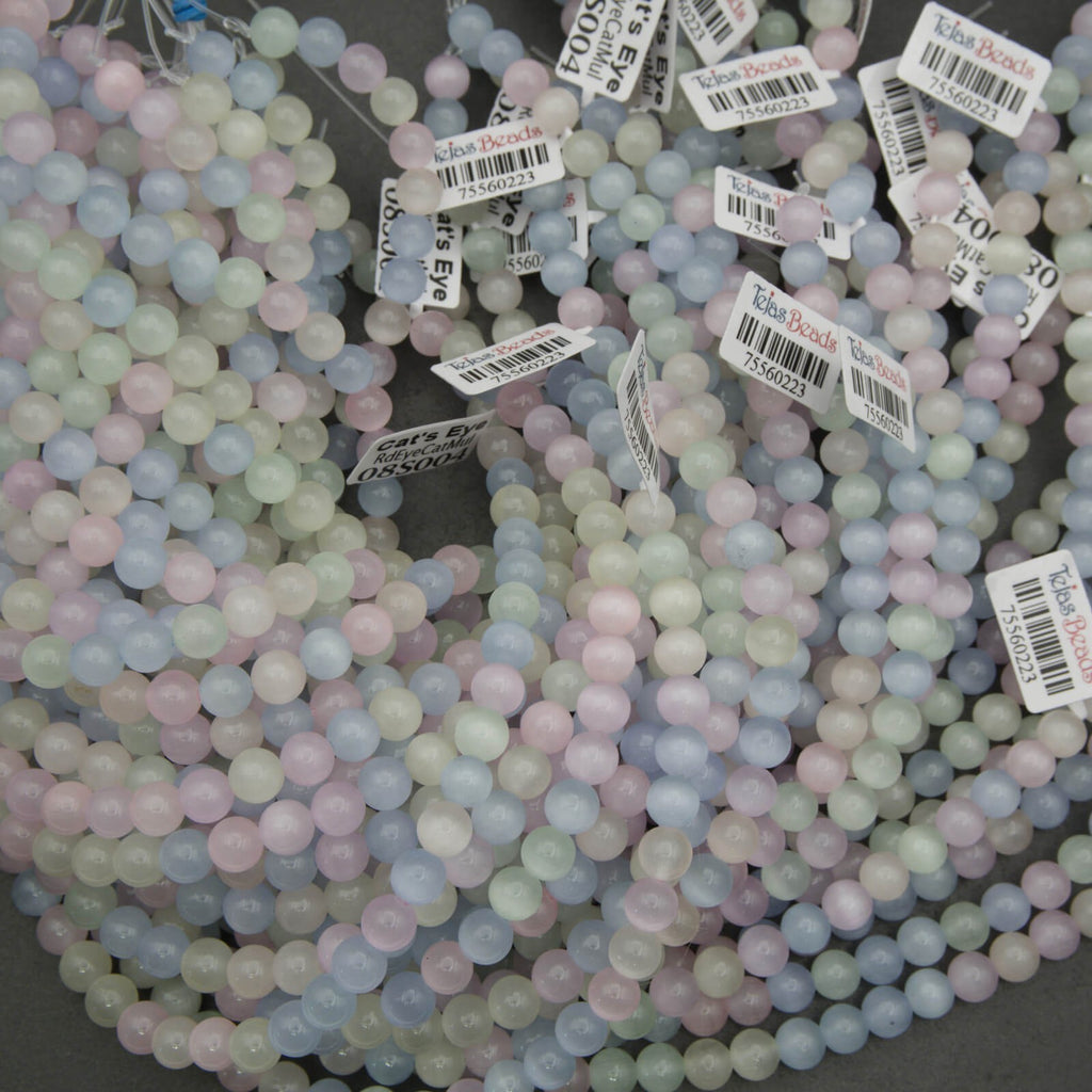 Pastel colored beads with barcodes on a dark background