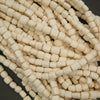 Close-up of beige beads on a dark background