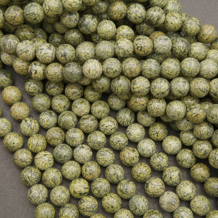 Natural Russian Serpentine round beads featuring earthy green tones and dark veining
