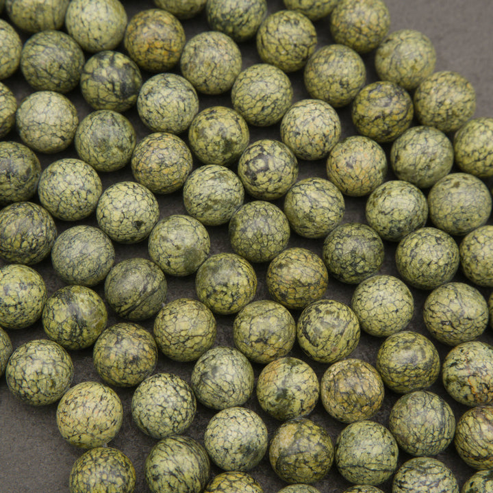 Russian Serpentine round beads displaying natural color and pattern variation