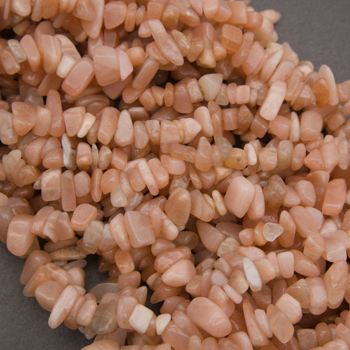 Close-up of pinkish-orange pebbles on a gray background